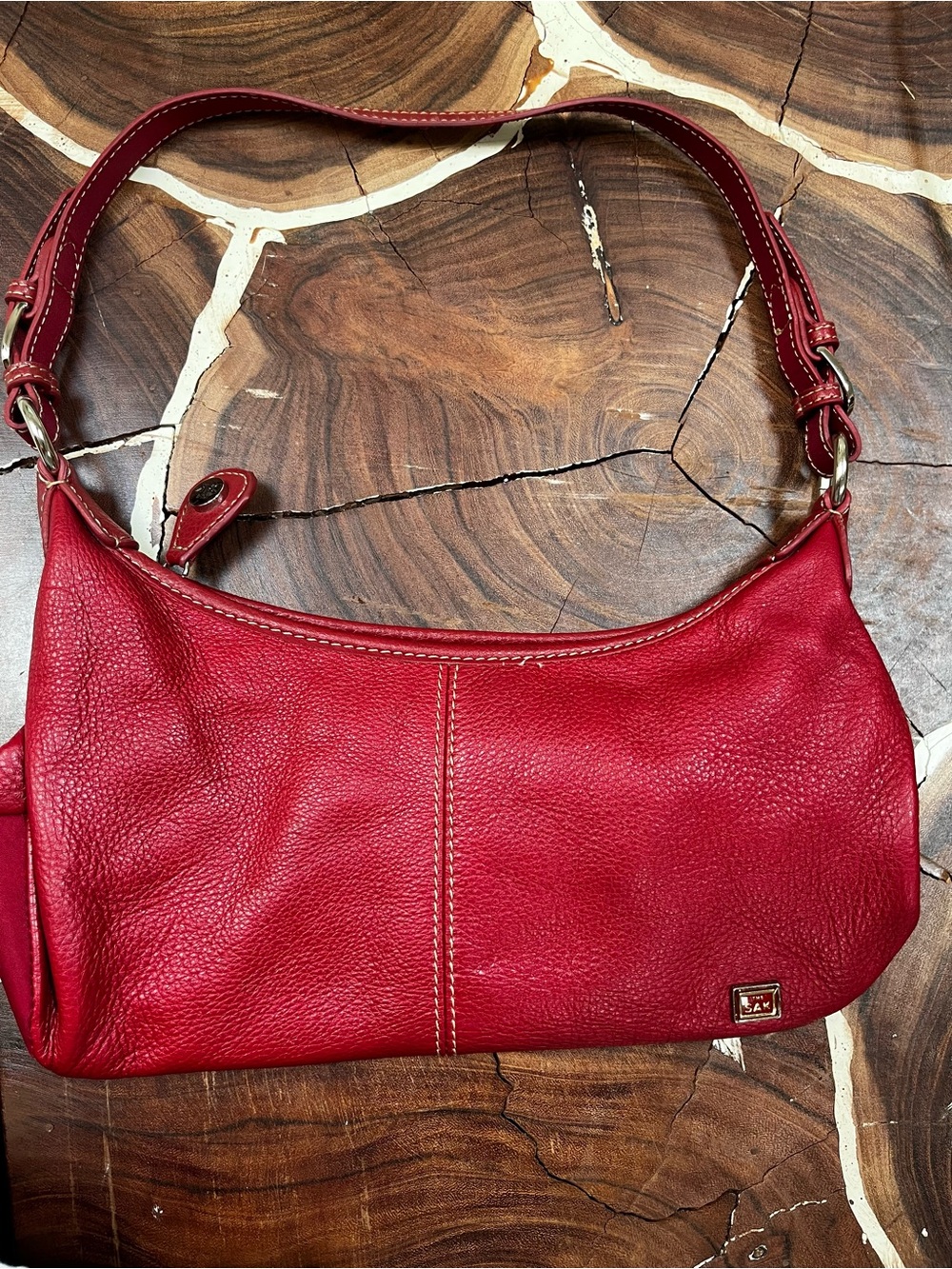 The Sak red leather purse